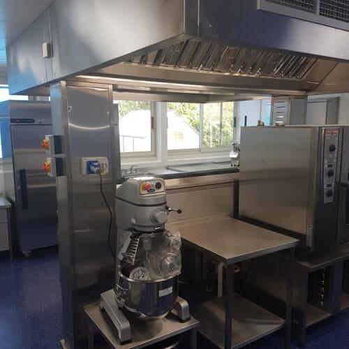 Stainless steel kitchen designs, with a commercial mixer